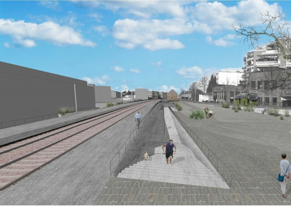 NYE RAMPER: Det er foreslått å bygge en ny rampe på to og en halv meter fra undergangen til terrenget mot Sentrumsbygget.